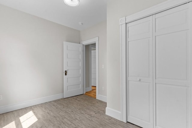 11 Taft St, Coventry, RI 02816 - unfurnished bedroom with light wood-style flooring and a closet