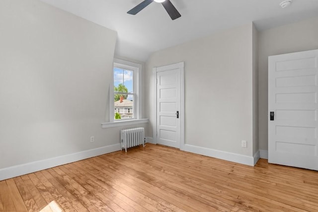 11 Taft St, Coventry, RI 02816 - unfurnished bedroom featuring radiator heating unit, light wood-style floors, lofted ceiling, and ceiling fan