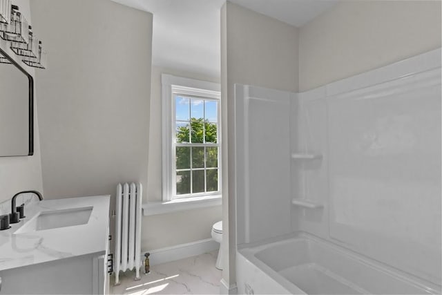 11 Taft St, Coventry, RI 02816 - full bath with radiator heating unit, marble finish flooring, vanity, and shower / washtub combination