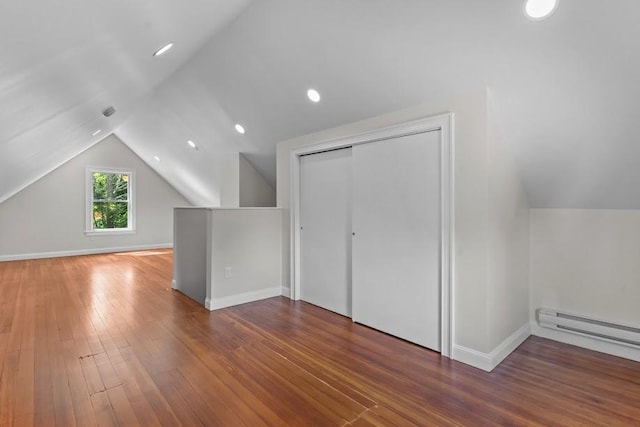 11 Taft St, Coventry, RI 02816 - additional living space featuring lofted ceiling, hardwood / wood-style flooring, and a baseboard heating unit