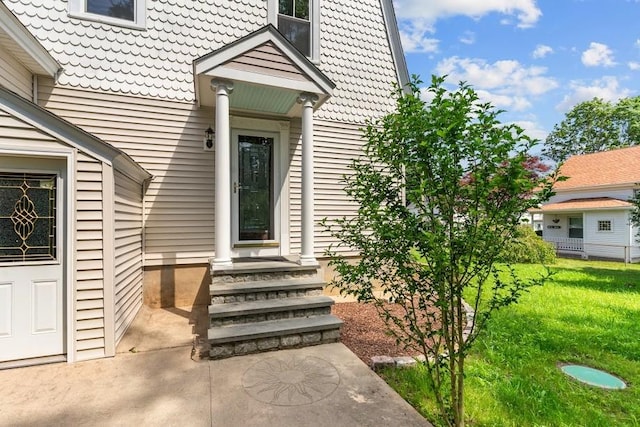 11 Taft St, Coventry, RI 02816 - doorway to property with a lawn