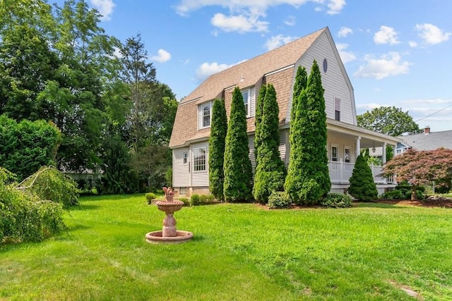 11 Taft St, Coventry, RI 02816 - view of home's exterior featuring a gambrel roof, a lawn, and roof with shingles