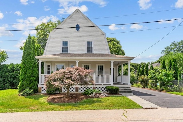 11 Taft St, Coventry, RI 02816 - view of front of home with covered porch, a gambrel roof, a front yard, and roof with shingles