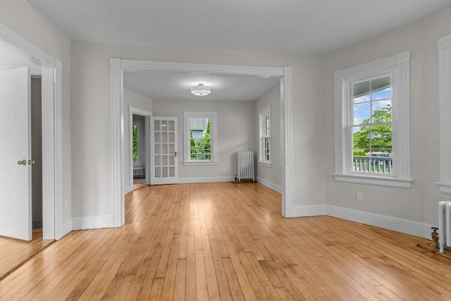 11 Taft St, Coventry, RI 02816 - spare room with light wood finished floors and radiator heating unit