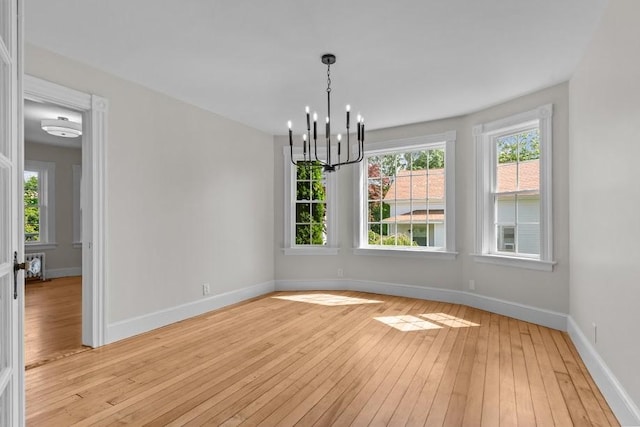 11 Taft St, Coventry, RI 02816 - unfurnished room with light wood-style flooring and a chandelier