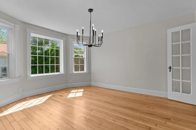 11 Taft St, Coventry, RI 02816 - spare room with a chandelier and light wood-type flooring