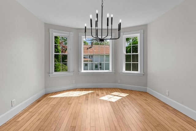 11 Taft St, Coventry, RI 02816 - unfurnished dining area featuring a chandelier and hardwood / wood-style flooring