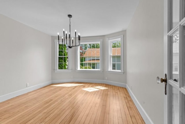11 Taft St, Coventry, RI 02816 - unfurnished dining area featuring light wood-style floors and a chandelier