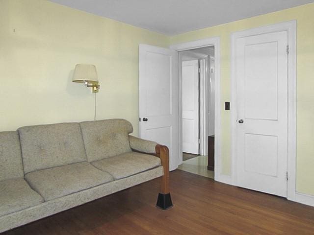 21 Hemlock Ave, Cranston, RI 02910 - living area with dark wood-type flooring and baseboards