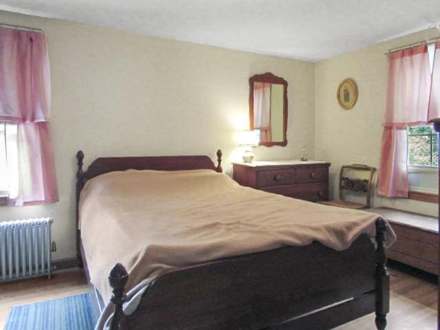 21 Hemlock Ave, Cranston, RI 02910 - bedroom featuring radiator and wood finished floors