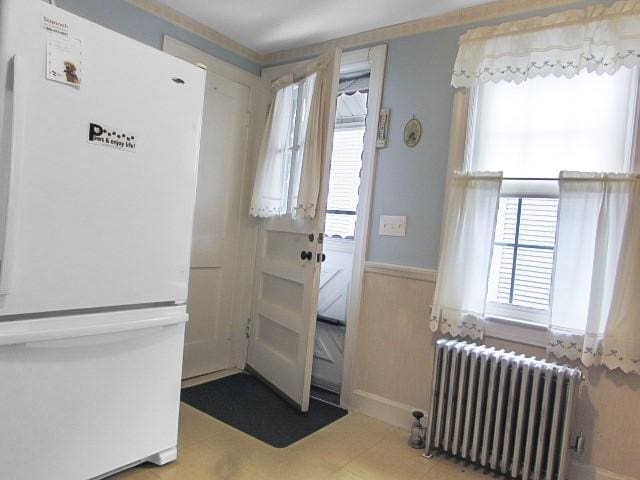 21 Hemlock Ave, Cranston, RI 02910 - doorway featuring radiator and a wainscoted wall