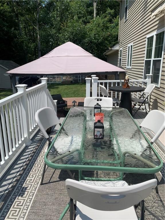 50 Paliotta Pkwy, Cranston, RI 02921 - wooden deck with outdoor dining space