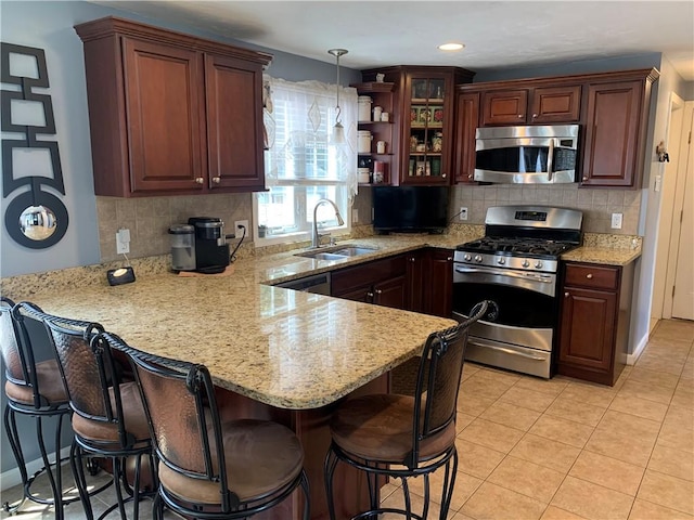50 Paliotta Pkwy, Cranston, RI 02921 - kitchen featuring stainless steel appliances, a peninsula, decorative backsplash, glass insert cabinets, and recessed lighting