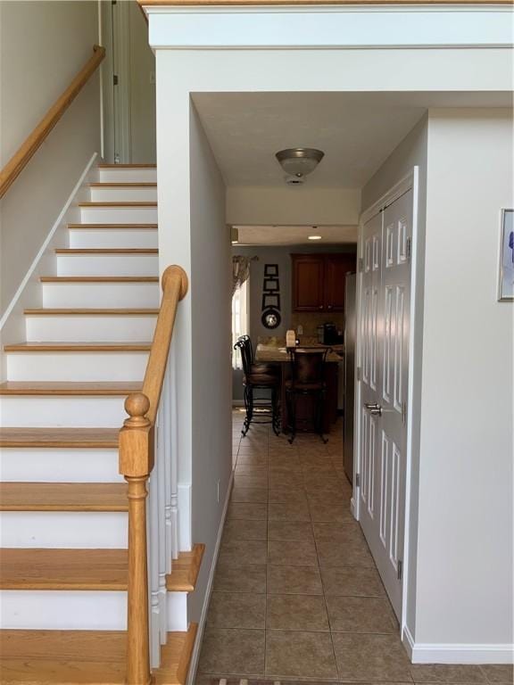 50 Paliotta Pkwy, Cranston, RI 02921 - hallway with light tile patterned floors and stairs