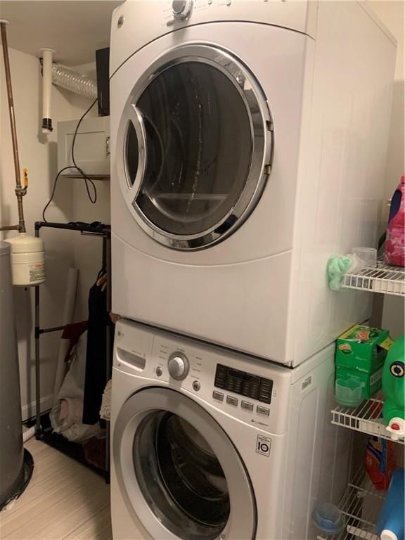 50 Paliotta Pkwy, Cranston, RI 02921 - washroom featuring stacked washer / drying machine and light wood-type flooring
