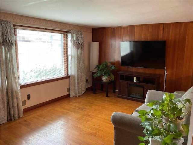 19 Leawood Dr, Cranston, RI 02920 - living room with plenty of natural light, light wood-style flooring, and a fireplace