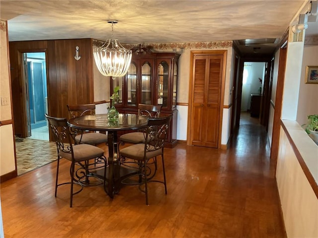 19 Leawood Dr, Cranston, RI 02920 - dining area featuring wood finished floors, a chandelier, and wooden walls