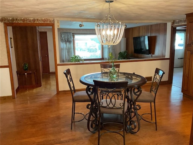 19 Leawood Dr, Cranston, RI 02920 - dining room with wood finished floors, plenty of natural light, and a chandelier