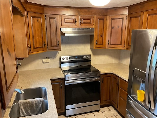 19 Leawood Dr, Cranston, RI 02920 - kitchen featuring appliances with stainless steel finishes, under cabinet range hood, light countertops, and backsplash