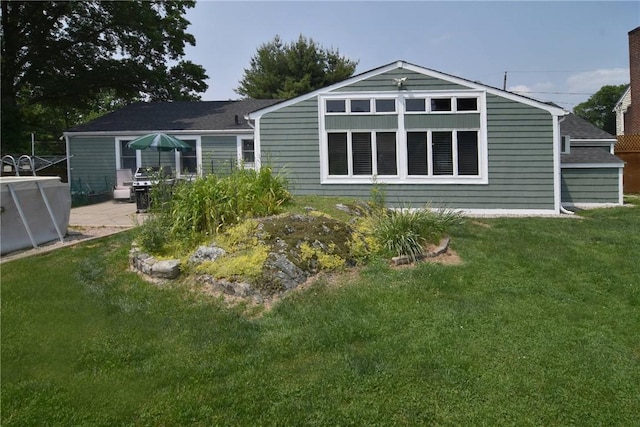 32 Harrington Dr, Johnston, RI 02919 - back of house featuring a lawn, a patio area, and a shingled roof