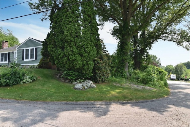 32 Harrington Dr, Johnston, RI 02919 - view of front of home with a chimney and a front lawn