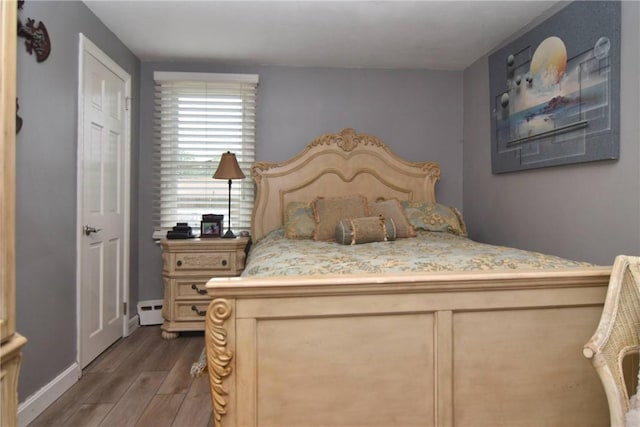 32 Harrington Dr, Johnston, RI 02919 - bedroom featuring dark wood finished floors and a baseboard radiator