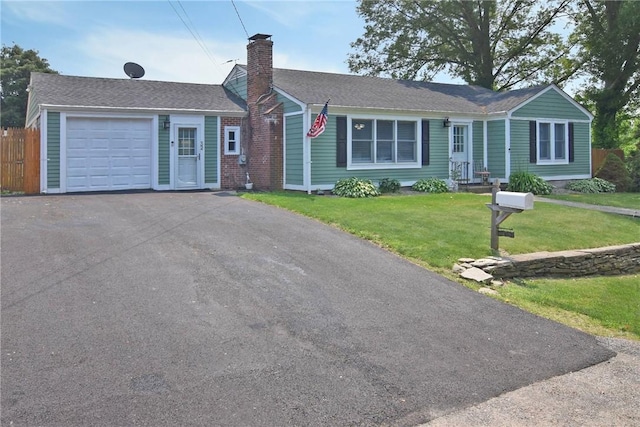 32 Harrington Dr, Johnston, RI 02919 - ranch-style home featuring asphalt driveway, an attached garage, and a chimney