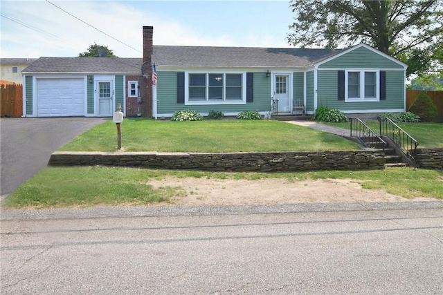 32 Harrington Dr, Johnston, RI 02919 - ranch-style home with asphalt driveway, an attached garage, and a chimney