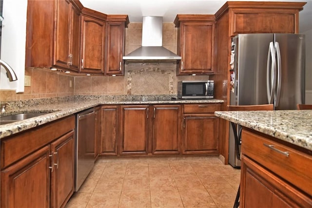 32 Harrington Dr, Johnston, RI 02919 - kitchen featuring wall chimney range hood, decorative backsplash, appliances with stainless steel finishes, and light stone counters