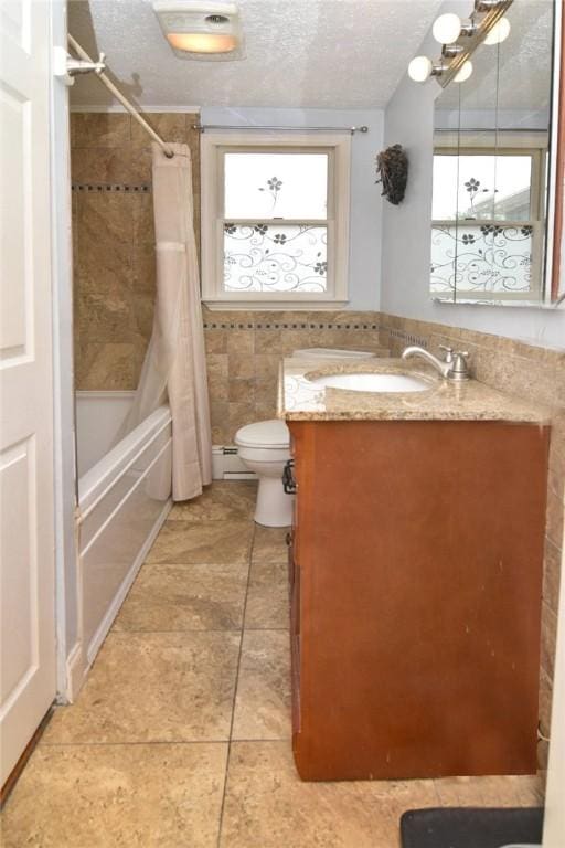 32 Harrington Dr, Johnston, RI 02919 - bathroom with vanity, a textured ceiling, tile patterned floors, shower / tub combo with curtain, and tile walls