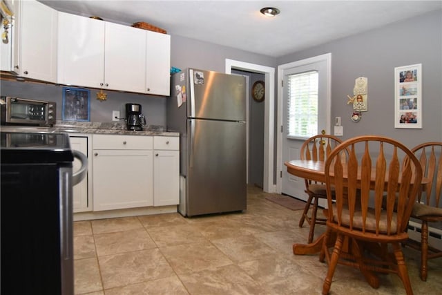 32 Harrington Dr, Johnston, RI 02919 - kitchen with stainless steel appliances, white cabinetry, and light stone countertops
