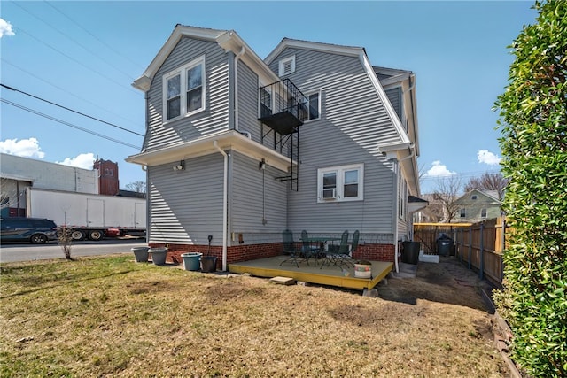 1264 Elmwood Ave, Providence, RI 02907 - rear view of house with a gambrel roof, a balcony, and a wooden deck