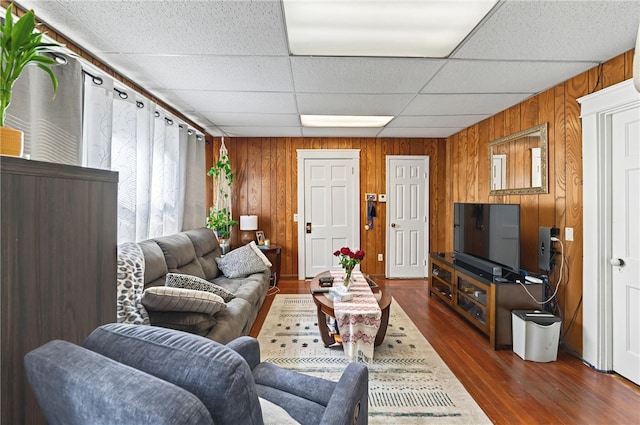 1264 Elmwood Ave, Providence, RI 02907 - living area with wood walls, dark wood finished floors, and a drop ceiling