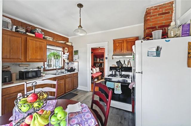 1264 Elmwood Ave, Providence, RI 02907 - kitchen with freestanding refrigerator, range with gas stovetop, light countertops, wood finished floors, and brown cabinets