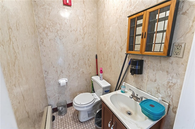 1264 Elmwood Ave, Providence, RI 02907 - half bath with vanity, tile patterned floors, and a baseboard heating unit