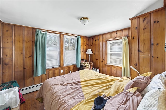 1264 Elmwood Ave, Providence, RI 02907 - bedroom with baseboard heating, wood finished floors, and wood walls