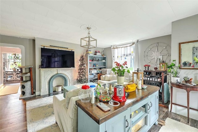 571 Spring St, Newport, RI 02840 - living area with healthy amount of natural light, wood finished floors, and a fireplace