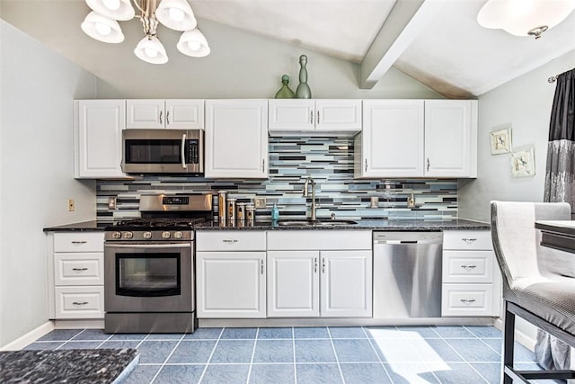 9 Ivy Hollow Ct, Cranston, RI 02921 - kitchen with appliances with stainless steel finishes, backsplash, white cabinets, and a chandelier
