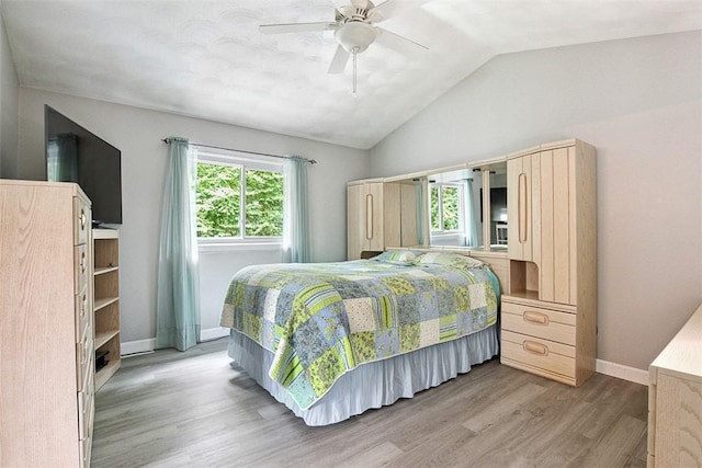 9 Ivy Hollow Ct, Cranston, RI 02921 - bedroom with wood finished floors, vaulted ceiling, and ceiling fan
