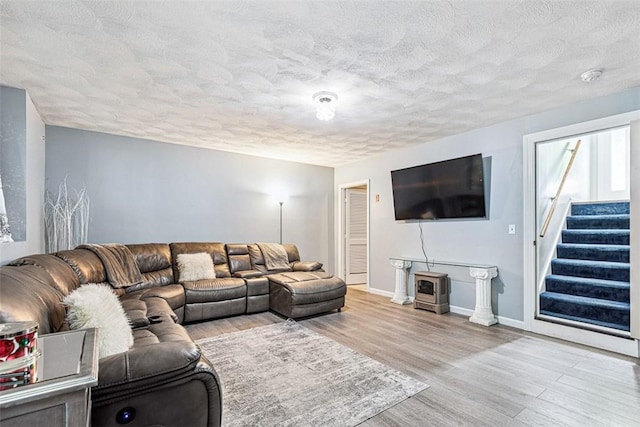9 Ivy Hollow Ct, Cranston, RI 02921 - living area featuring wood finished floors, a textured ceiling, and stairway