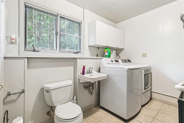 9 Ivy Hollow Ct, Cranston, RI 02921 - laundry area with washing machine and dryer and light tile patterned floors