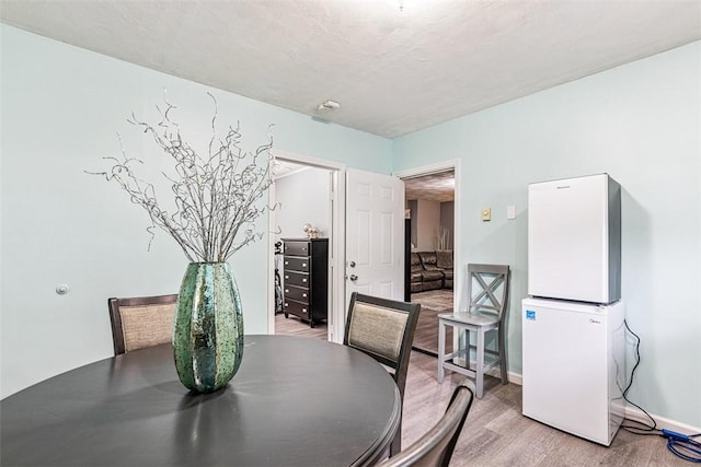 9 Ivy Hollow Ct, Cranston, RI 02921 - dining room featuring light wood-style floors and baseboards