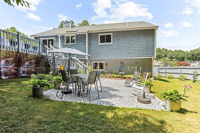 9 Ivy Hollow Ct, Cranston, RI 02921 - back of property with stairs, a patio, a chimney, and a shingled roof
