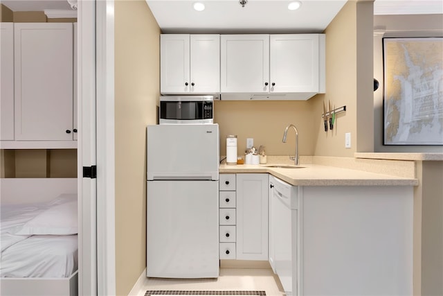 65 Weybosset St Unit 222, Providence, RI 02903 - kitchen with white appliances, white cabinetry, light countertops, and recessed lighting