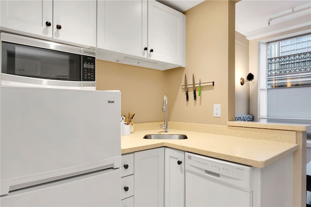 65 Weybosset St Unit 222, Providence, RI 02903 - kitchen featuring white appliances, white cabinets, and light countertops