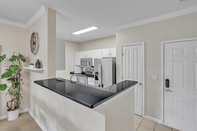 1000 Providence Pl Unit 201, Providence, RI 02903 - kitchen featuring a peninsula, stainless steel appliances, white cabinetry, crown molding, and dark countertops