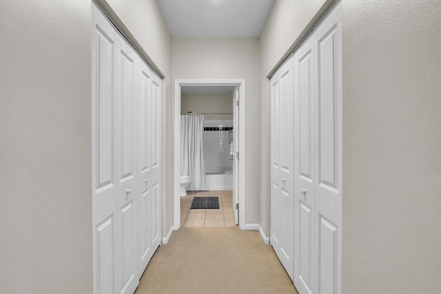 1000 Providence Pl Unit 201, Providence, RI 02903 - hallway with light tile patterned flooring and light colored carpet