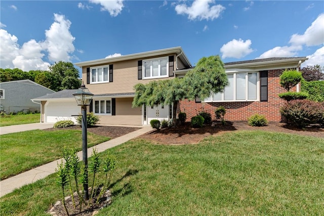 8 Sturbridge Ave, Smithfield, RI 02828 - view of front facade with brick siding, concrete driveway, and a front yard