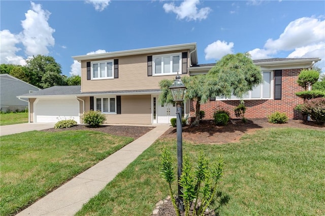 8 Sturbridge Ave, Smithfield, RI 02828 - traditional home with a garage, driveway, a front yard, and brick siding