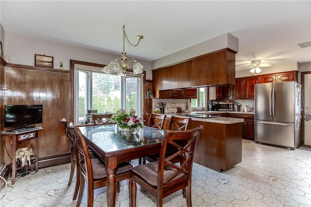 8 Sturbridge Ave, Smithfield, RI 02828 - dining room featuring a chandelier, healthy amount of natural light, and a ceiling fan